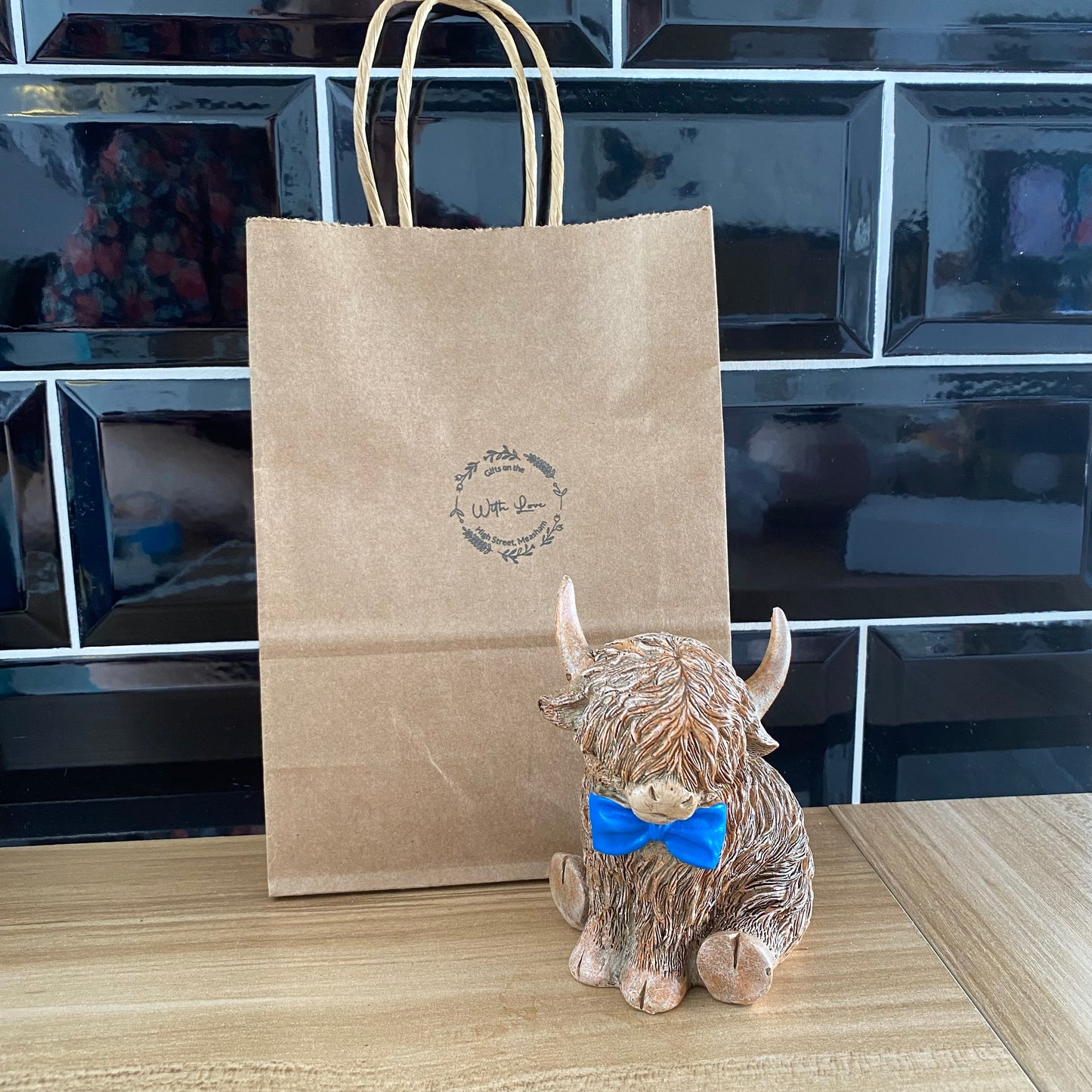 Highland cow with bow