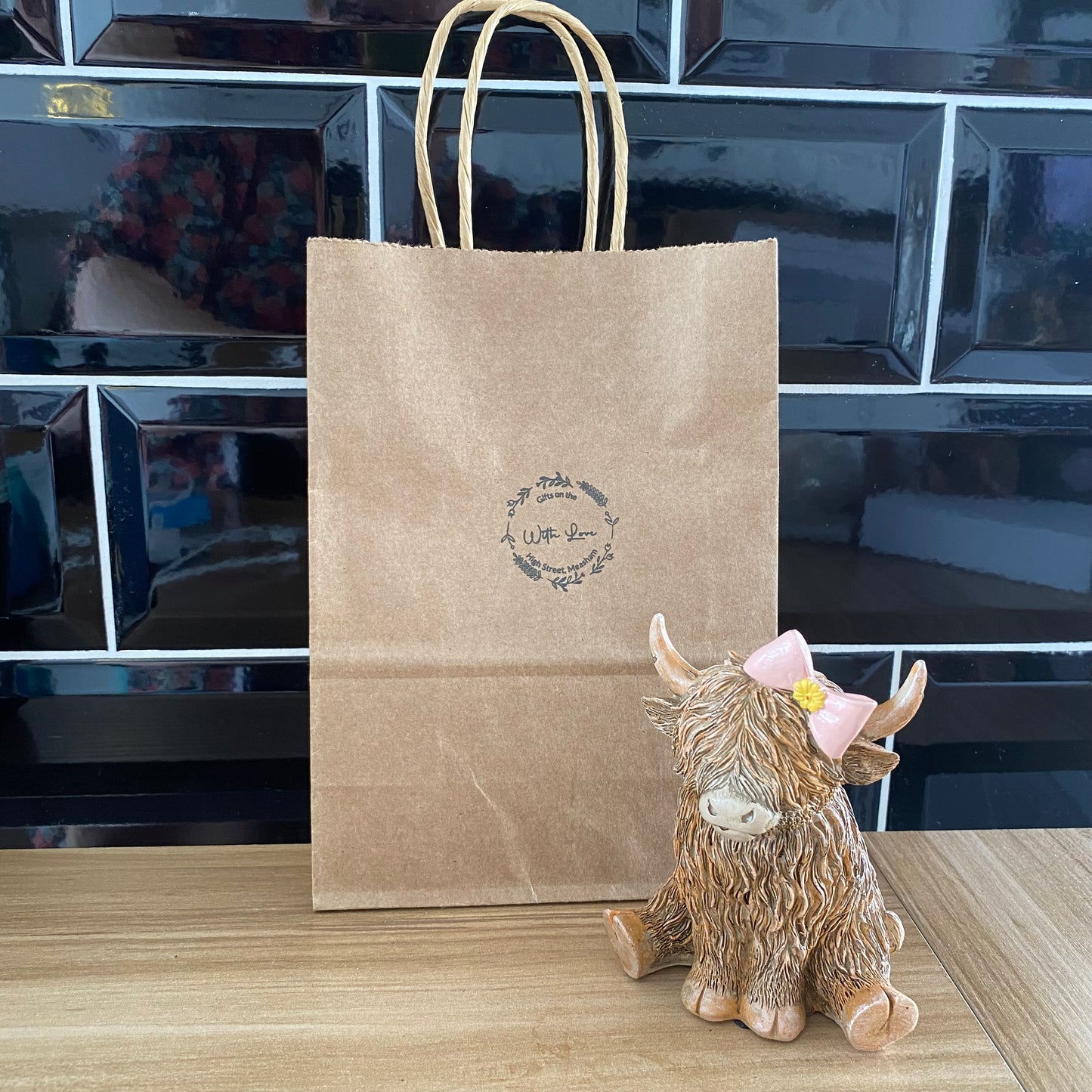 Highland cow with bow