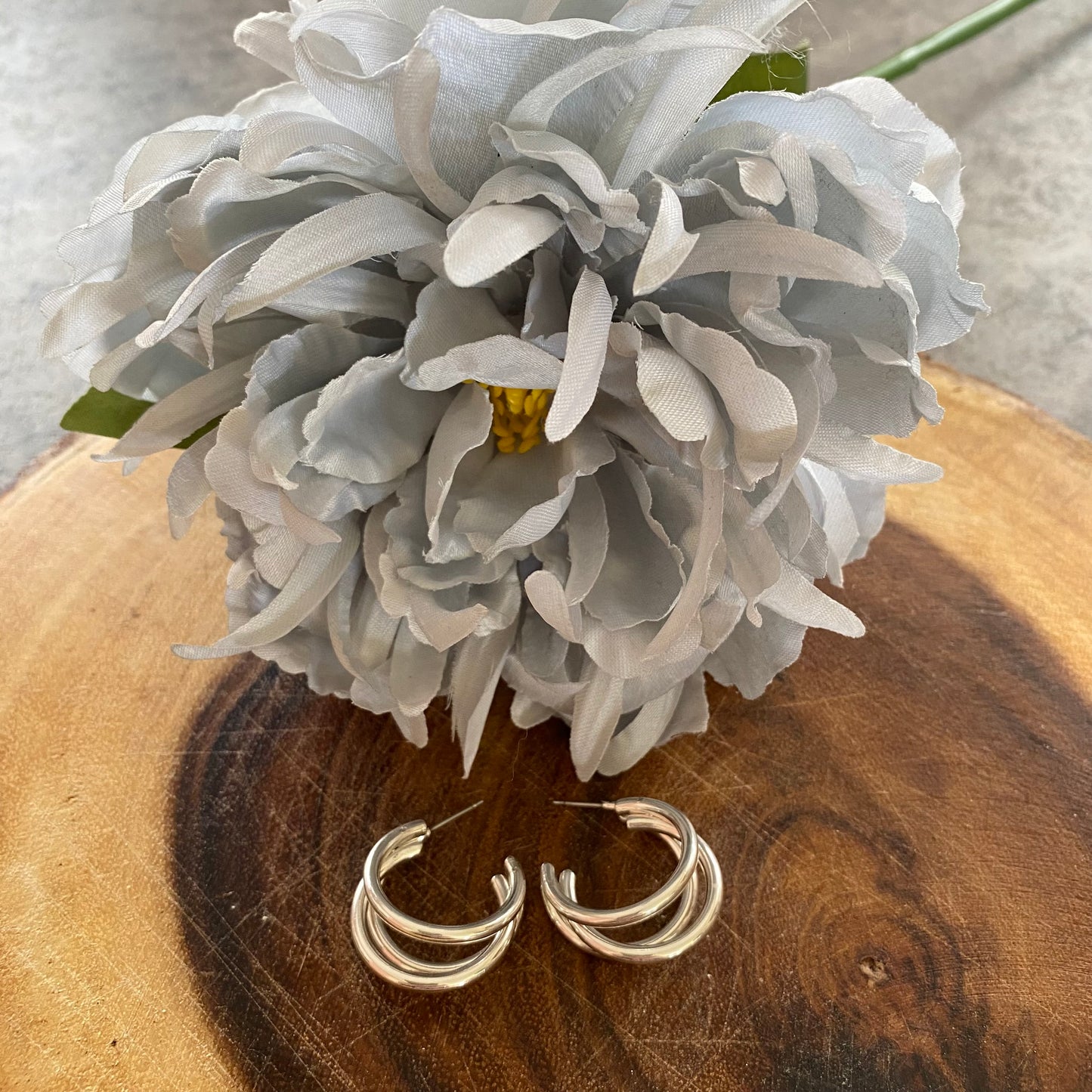 Silver coloured cut out hoop earrings