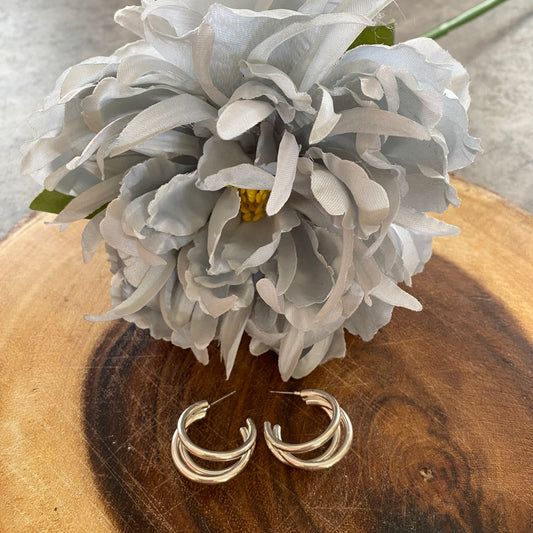 Silver coloured cut out hoop earrings